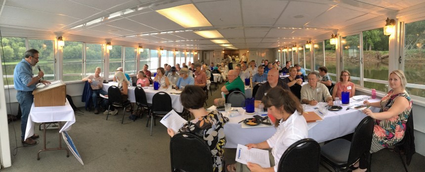 Jim Almendinger speaks to local leaders on the St. Croix River