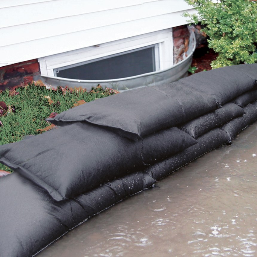sand bags in front of a window well