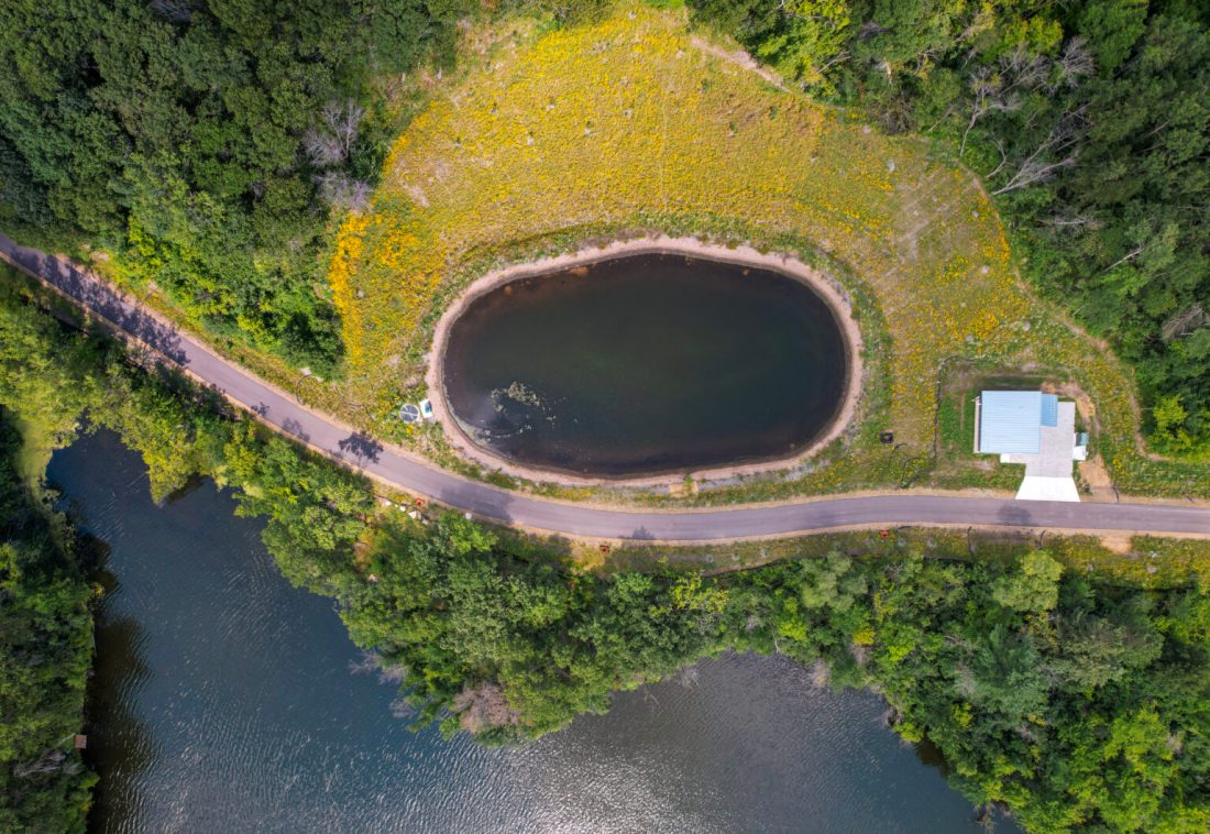 Aerial photo of pond, lake, and trail